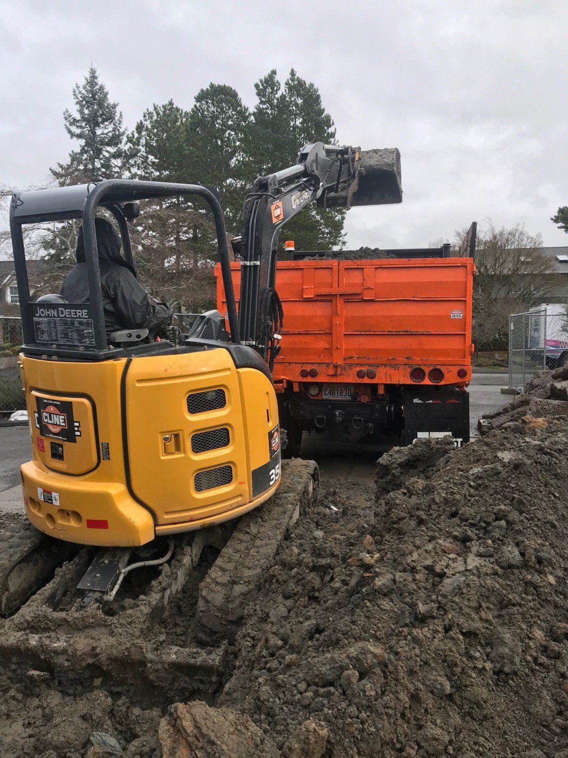 Dumptruck — Debris Loaded Into Orange Dumptruck In Everett, WA