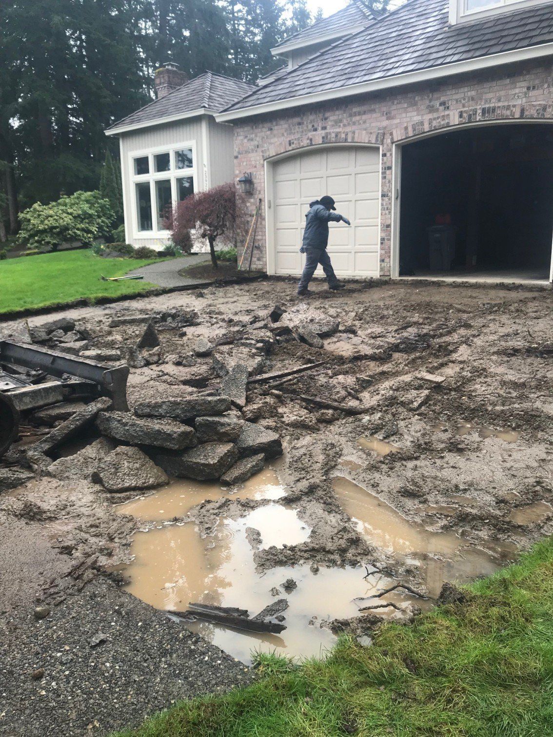 Demolition Worker — driveway during demolition process In Everett, WA
