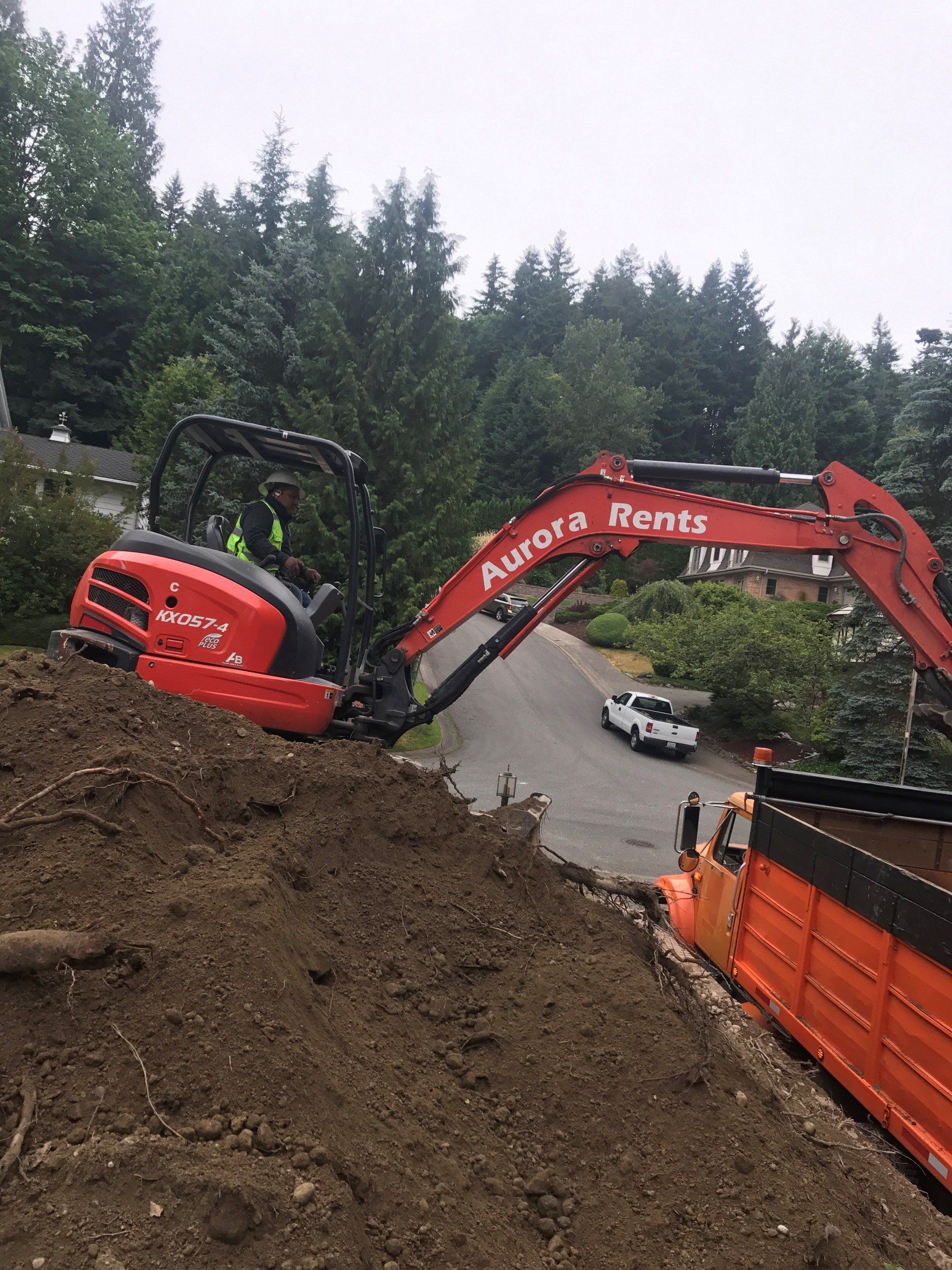Heavy Truck — Excavator At Work Removing Dirt In Everett, WA