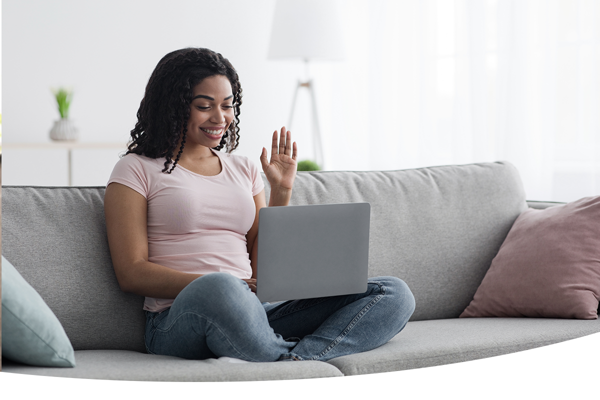 Person Sitting on couch having online counseling with Perspectives Counseling Center