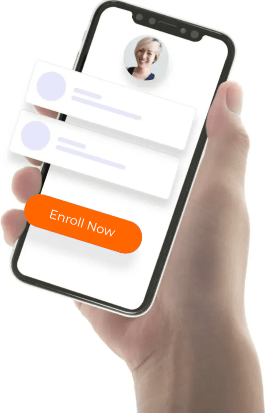 A hand is holding a cell phone with an enroll now button on the screen.