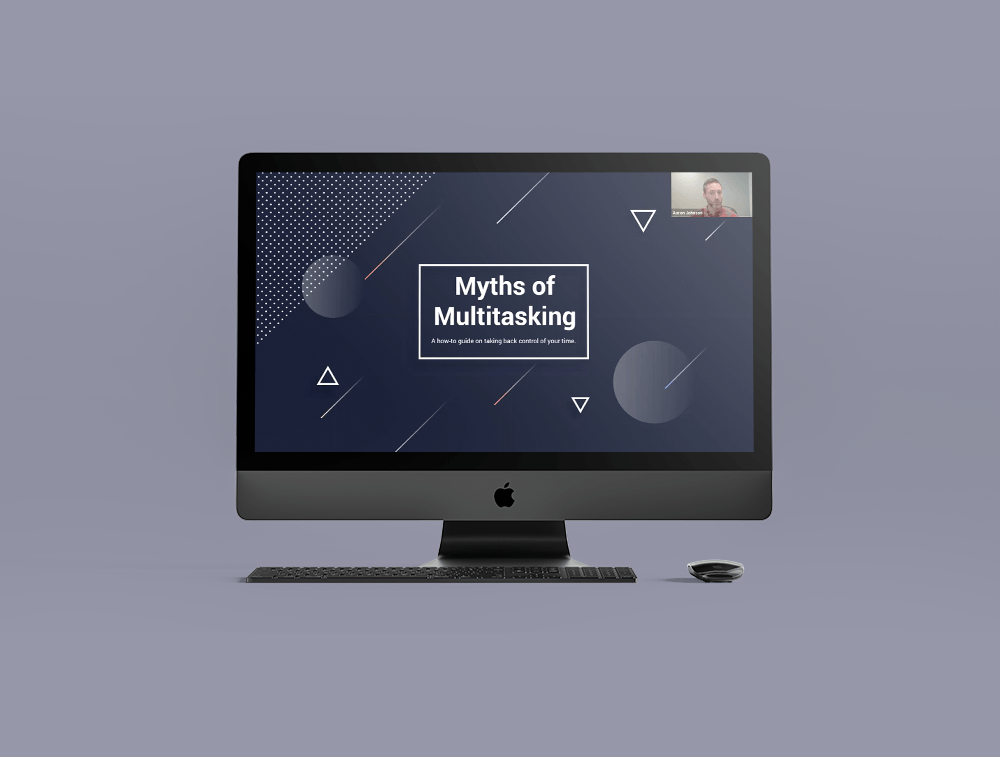 A computer monitor is displaying a presentation about multitasking