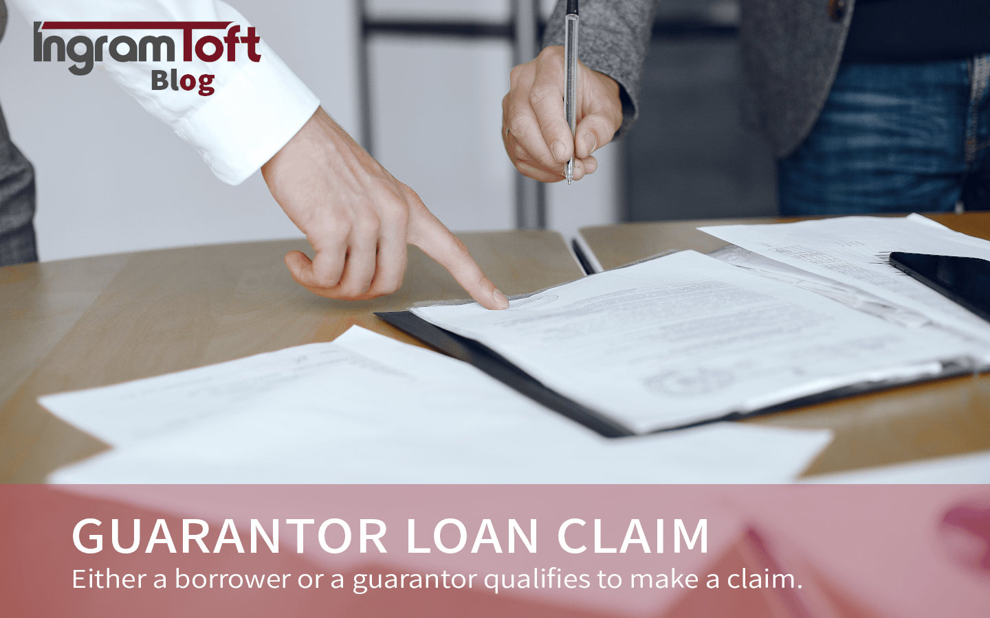 A person is pointing at a piece of paper that says guarantor loan claim