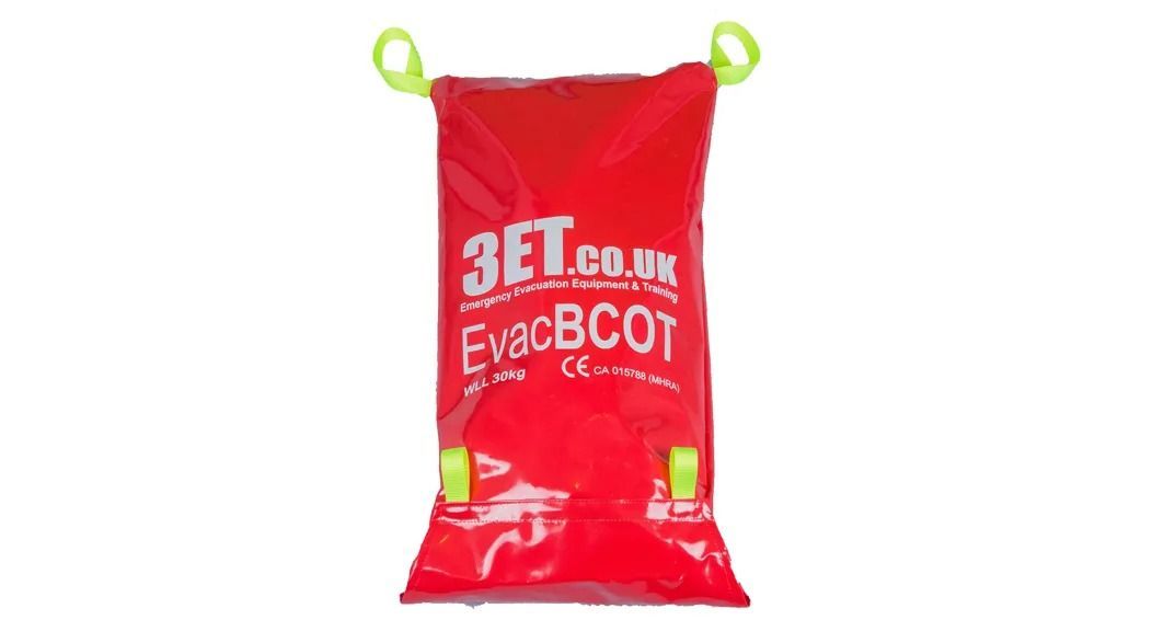 Red EvacBCot emergency evacuation cot with yellow handles and straps; white background.