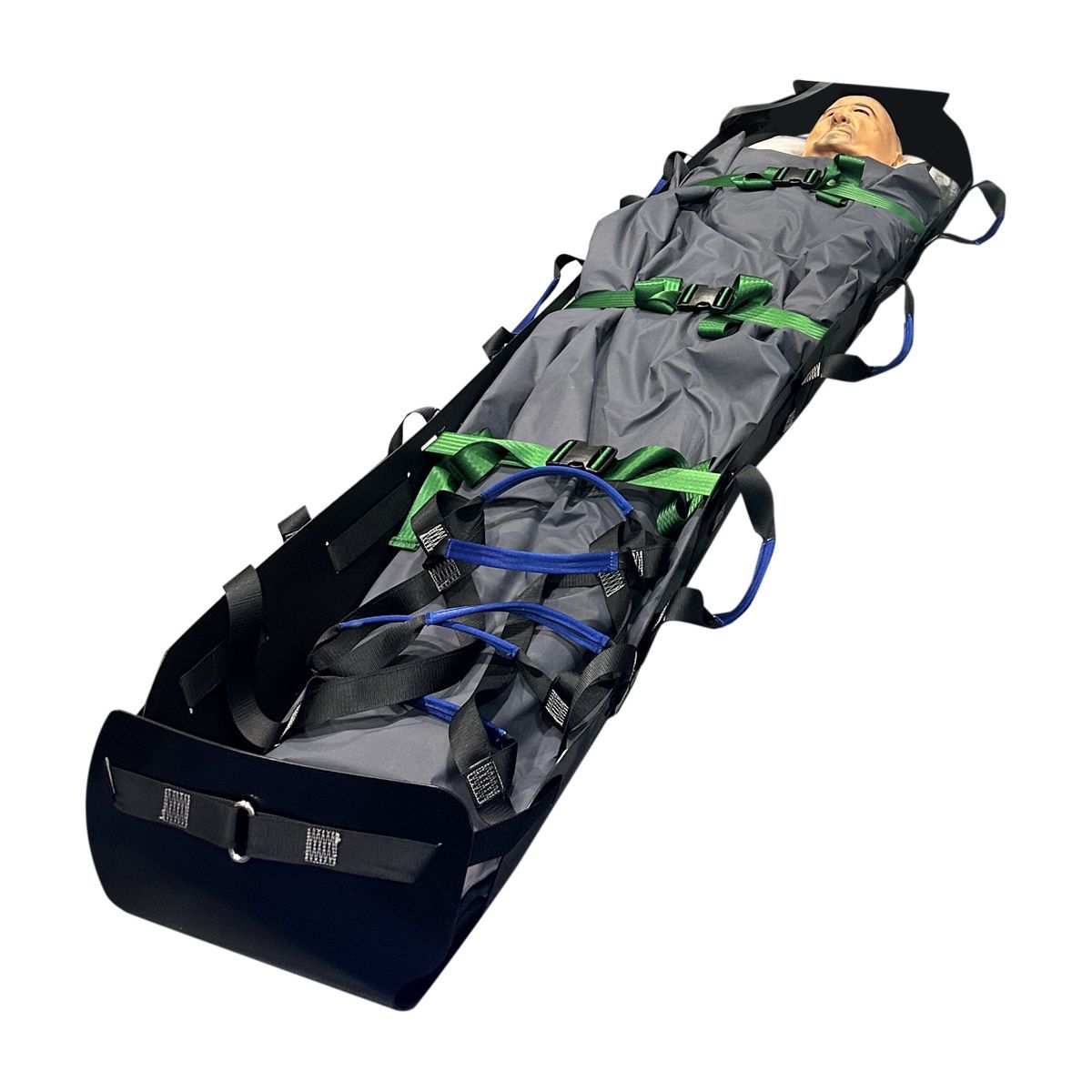 Patient on a stretcher; mannequin in grey wrap with green and blue straps, black frame.
