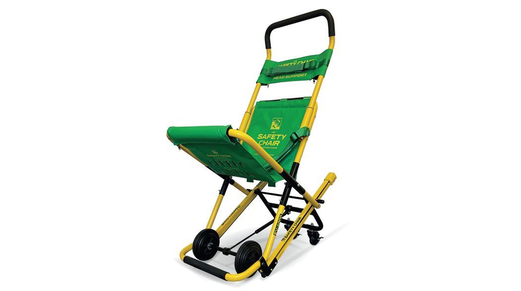 Green and yellow stair chair for medical emergencies, with black handle and wheels.