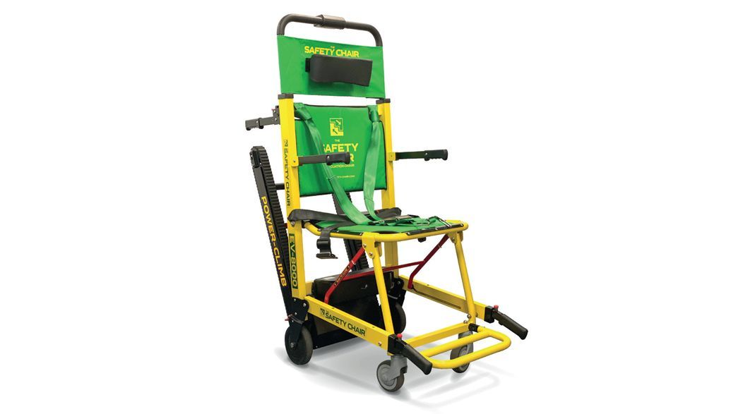 Green and yellow powered stair chair for emergency medical use.