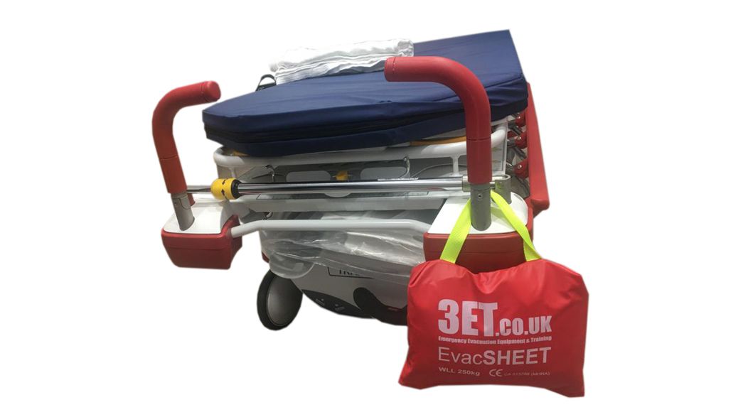 Wheelchair with red handles, a blue seat, and a hanging red bag labeled 