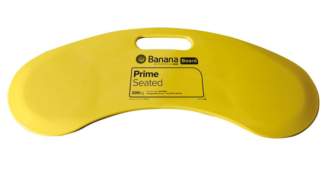 Yellow plastic banana-shaped transfer board with a handle.