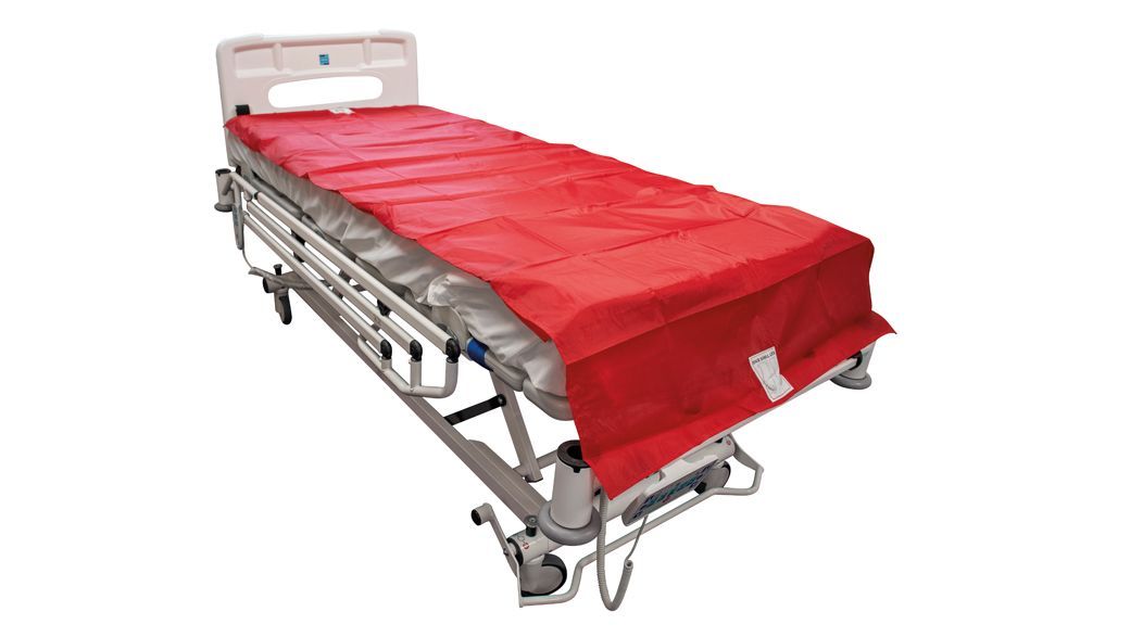 Red patient transfer sheet covering a hospital bed.