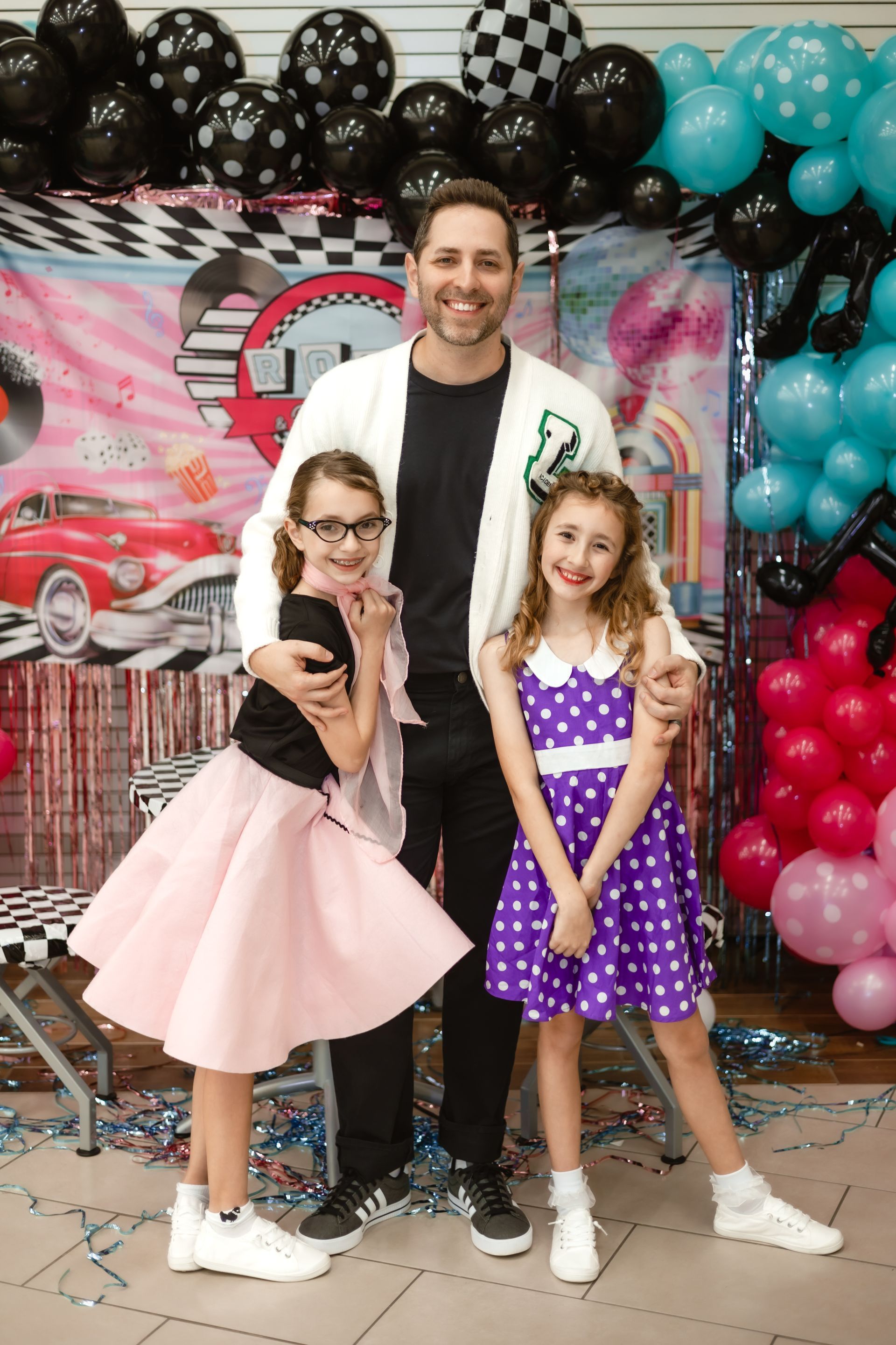 Ryan and his daughters at a father-daughter dance