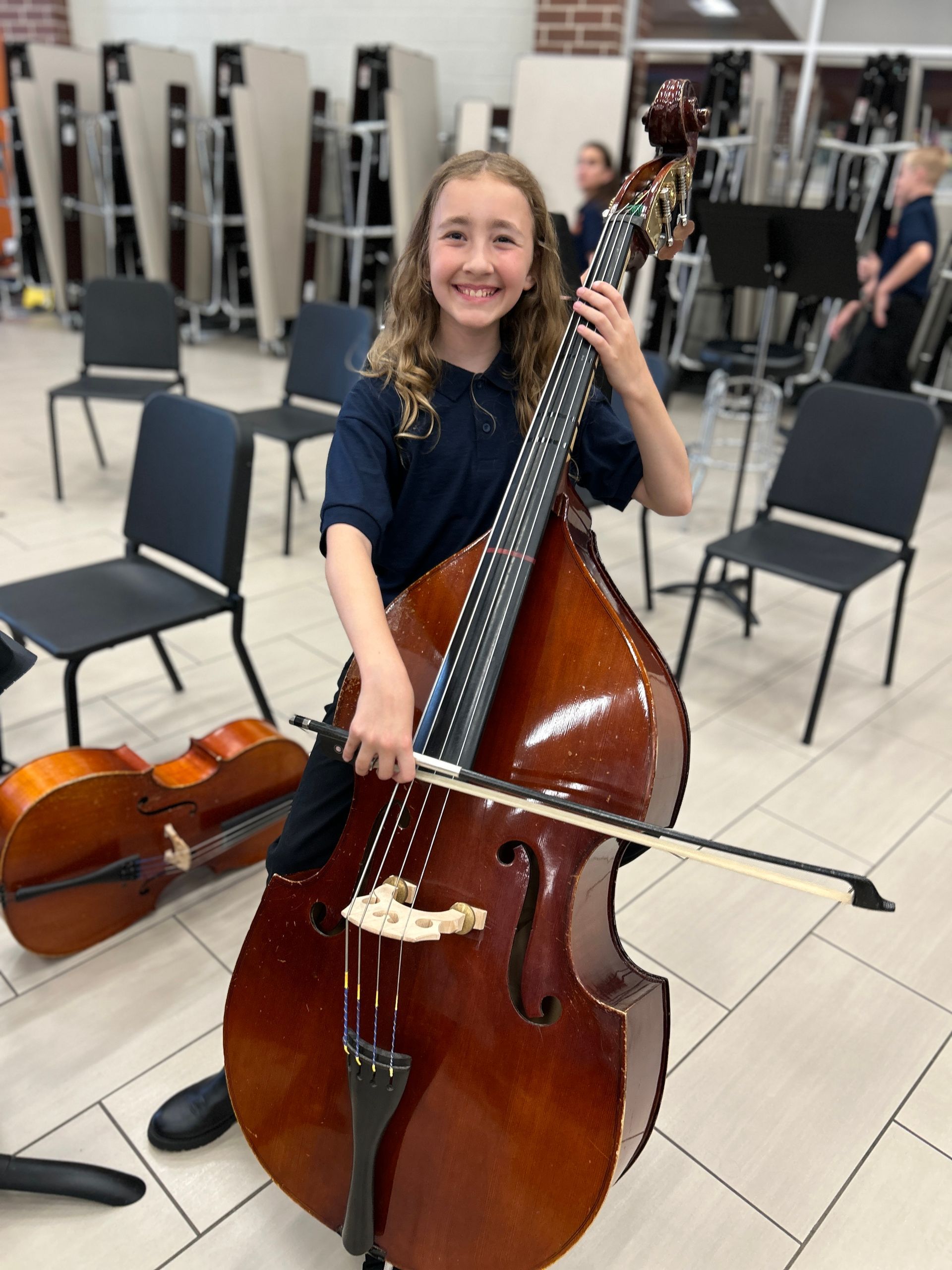 Ryan's daughter playing a double bass