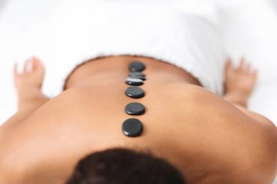 Hot Stones Laid Across the spine