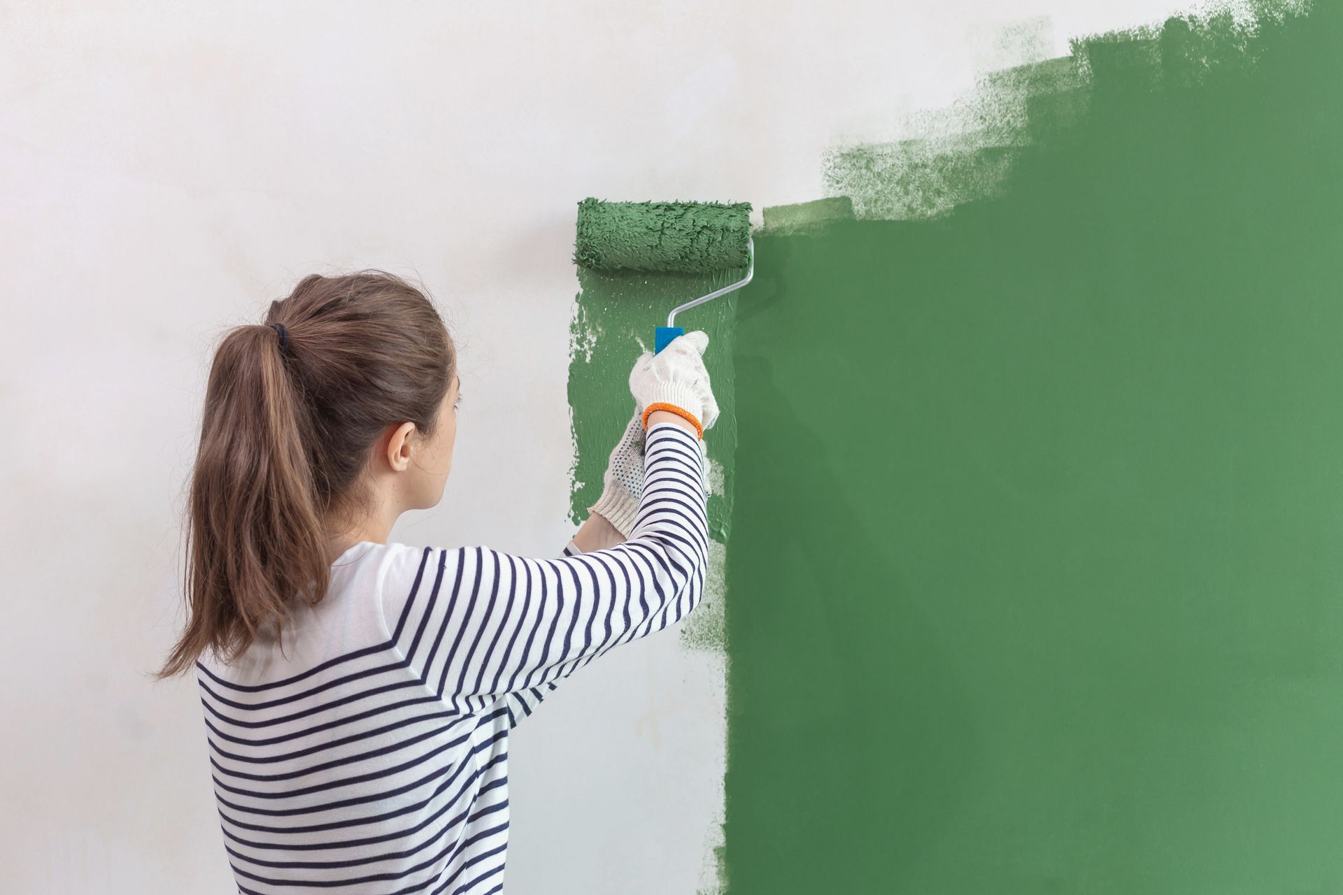 Painting a White Wall Green with A Paint Roller