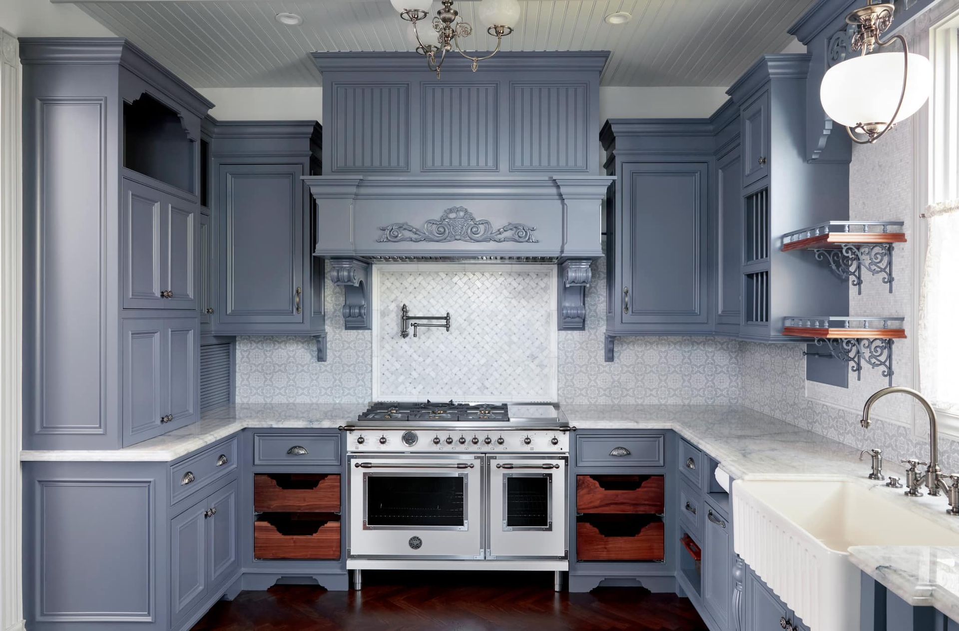 A kitchen with a stove top oven and a sink