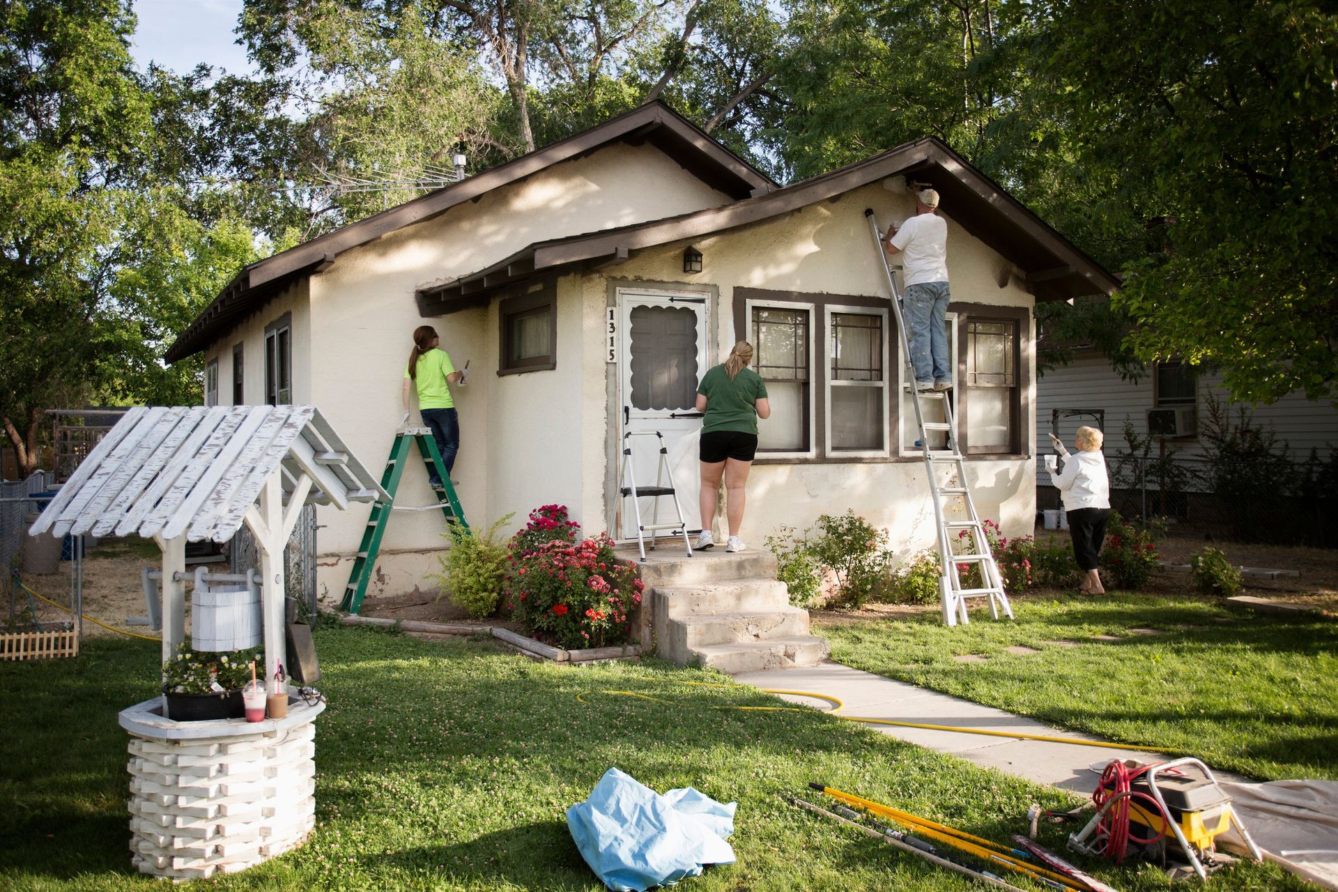 A Group Of People Are Painting A House | Port Charlotte, FL | All-Pro Demolition and Restoration LLC