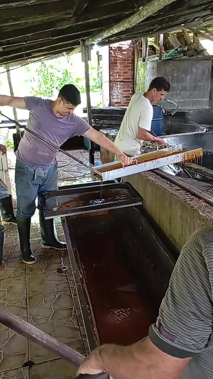 A group of men are working in a kitchen.