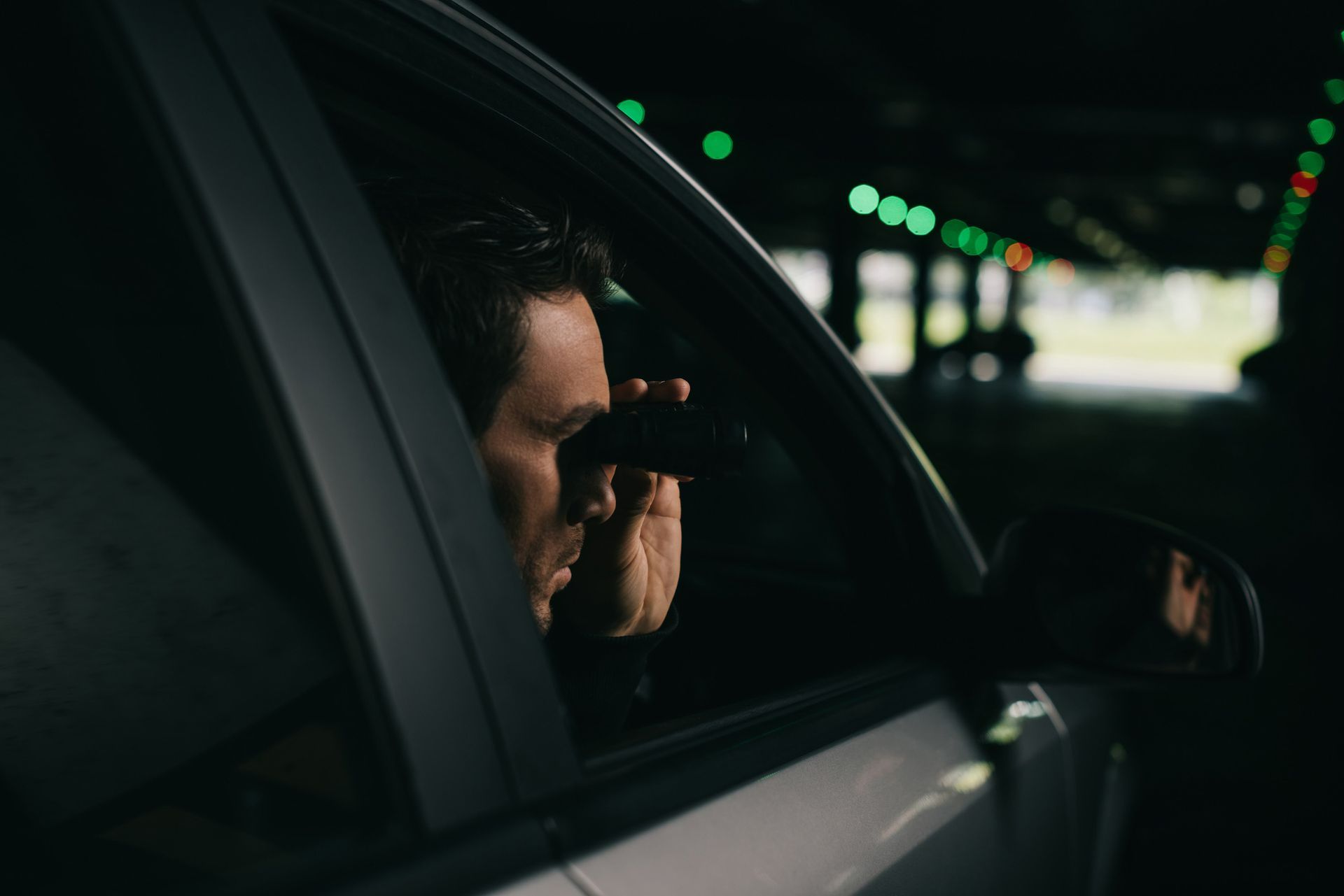 Male with binocular | Oak Flats, NSW | Noble Commercial & Investigations