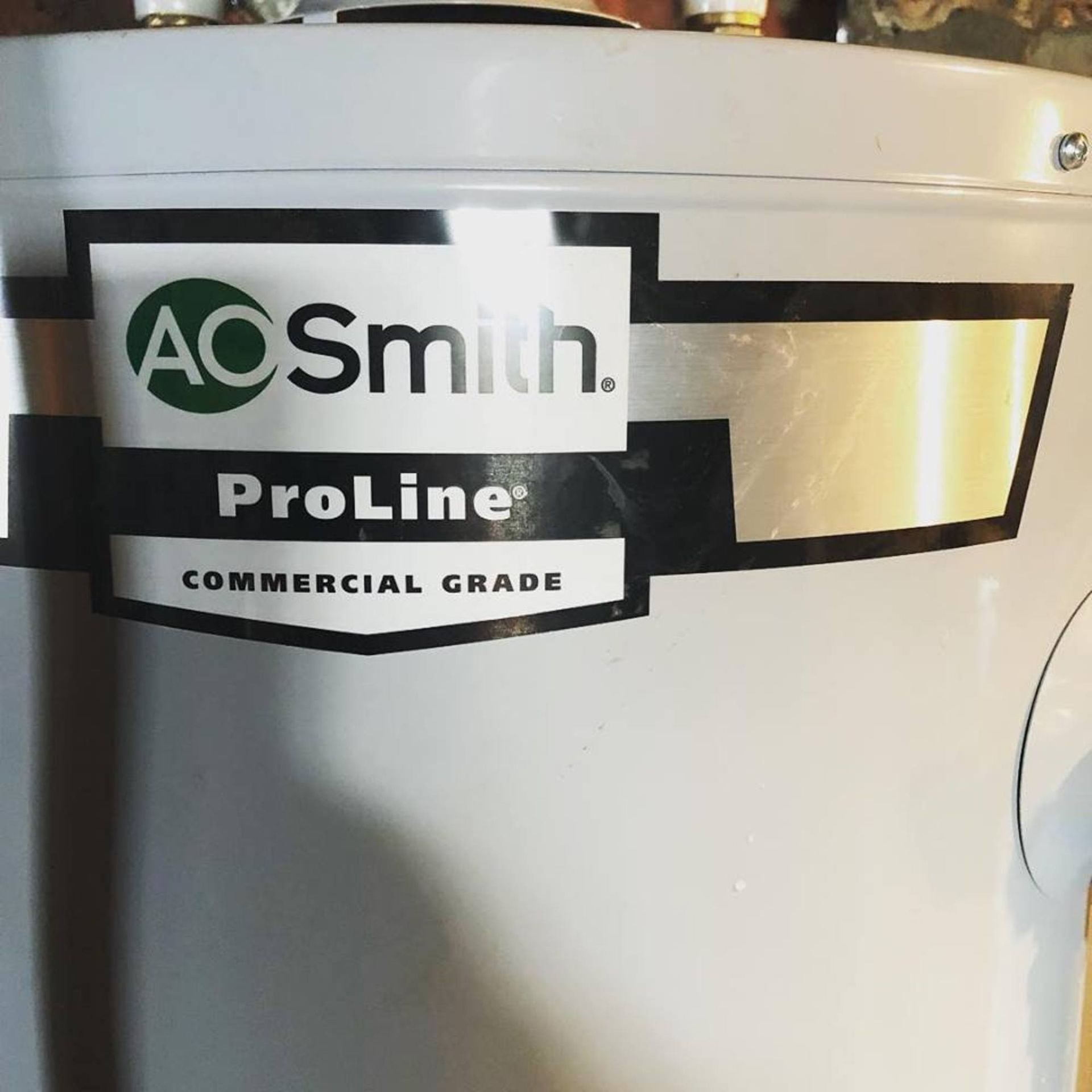 A white aosmith proline commercial grade water heater