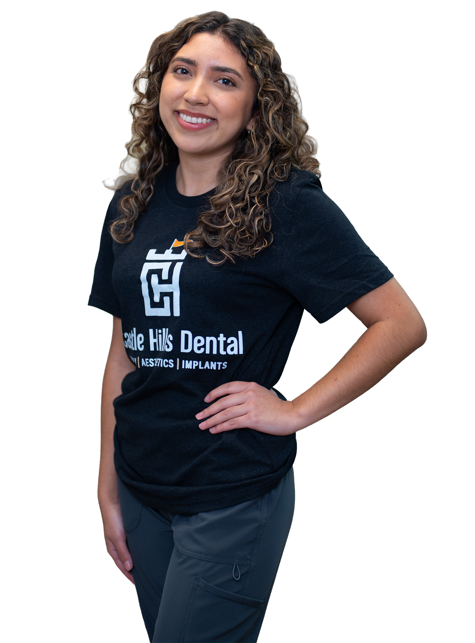 A woman in a Castle Hills Dental shirt  smiling