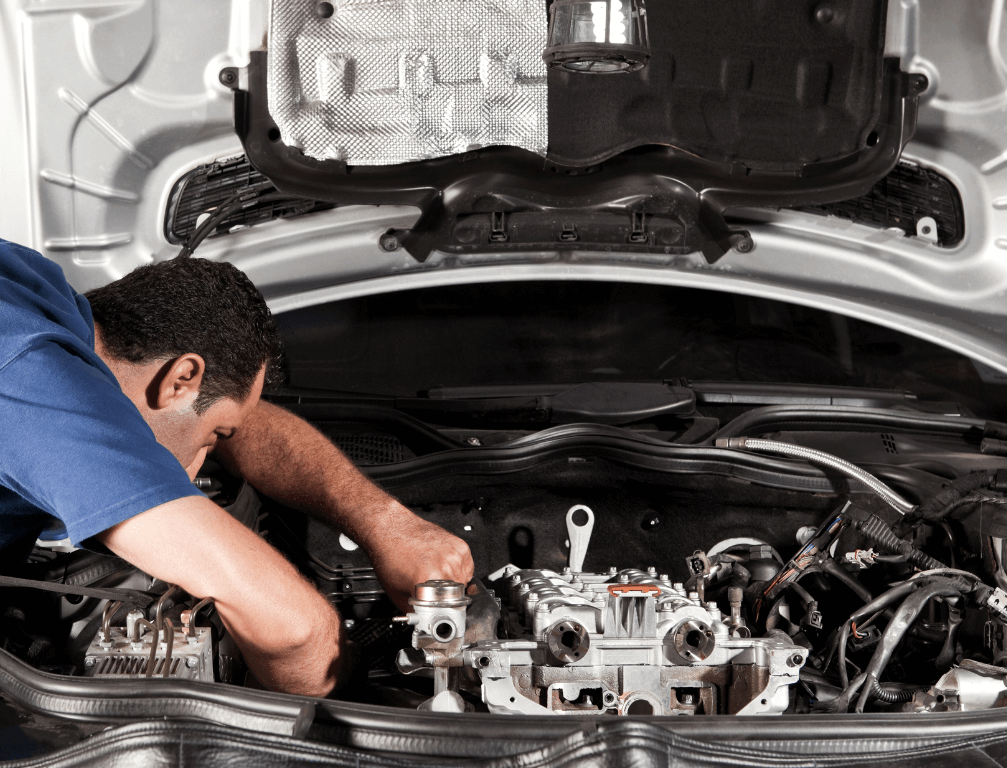 A mechanic doing an auto repair job