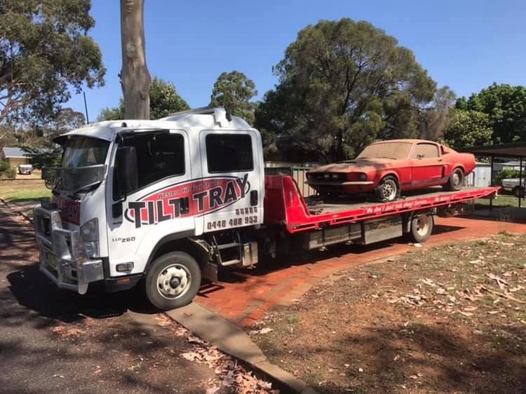 Truck Towing a Red Car — Towing in Coolah, NSW