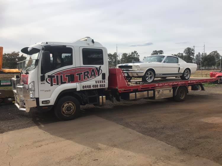 Truck Towing White Car — Service Areas in Dubbo, NSW