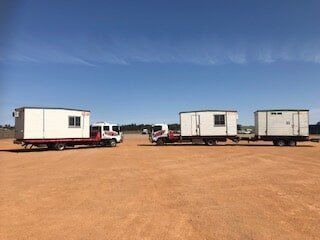 Truck Towing Worksite Container — Container Transport in Dubbo, NSW