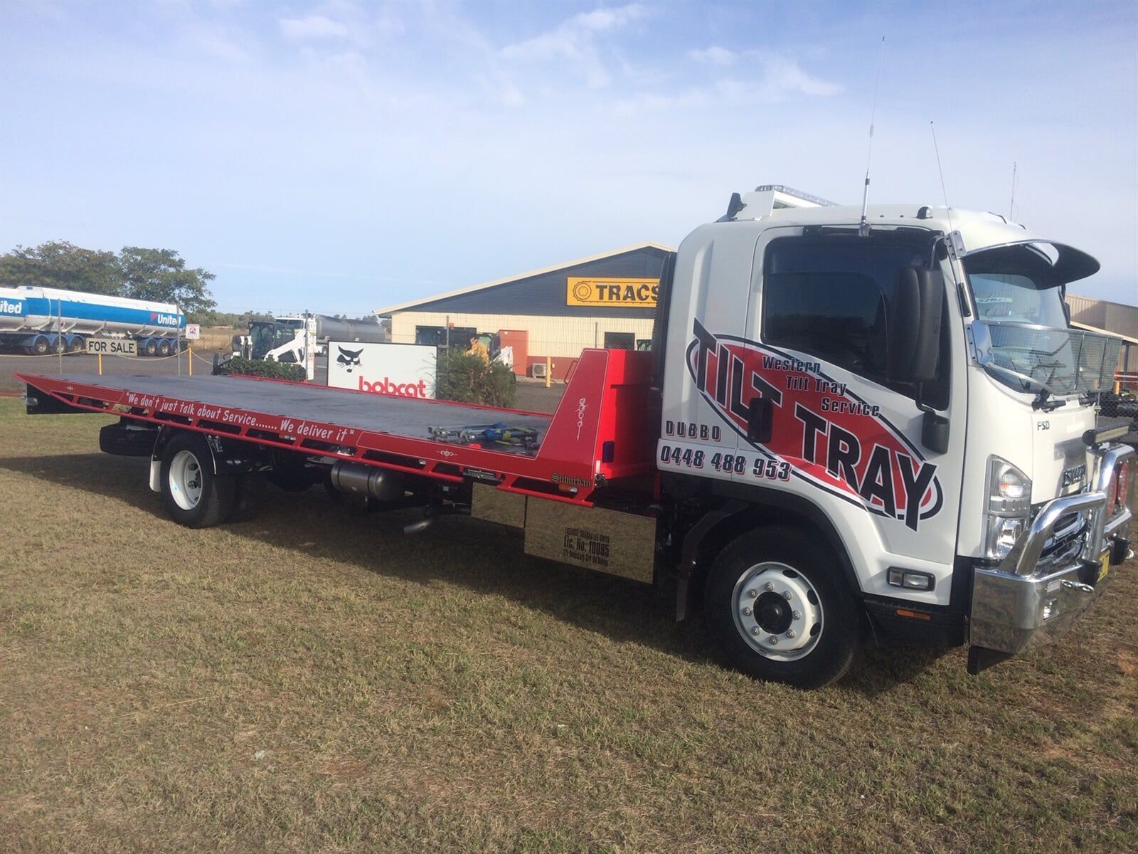 Tow truck parked on grass — Towing in Dubbo, NSW