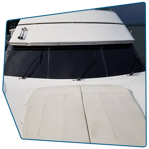 White boat deck and windshield with black glass; front view. White boat deck and windshield with black glass; front view.