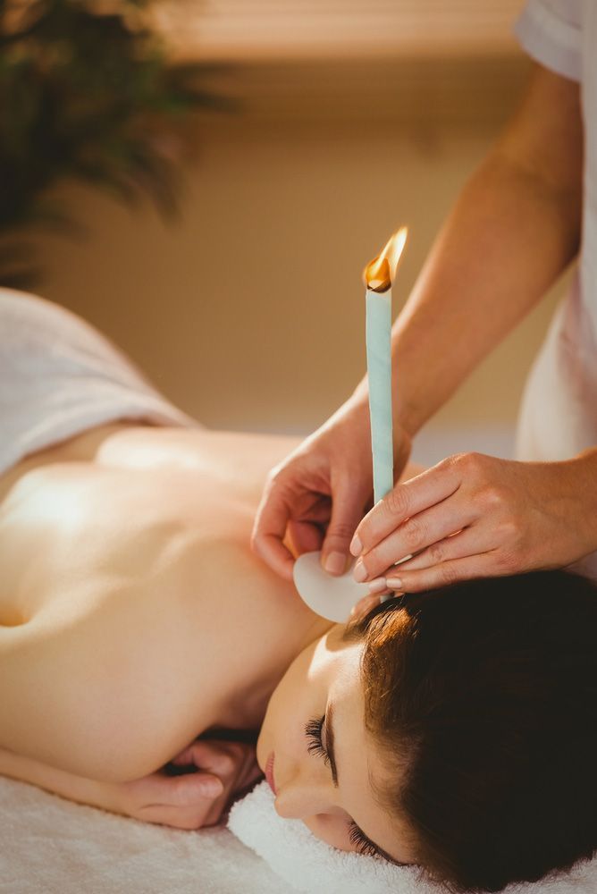 Young Woman Getting Ear Candling Treatment — Master Your Journey in Glenfield Park, NSW