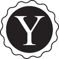 A black and white logo with the letter y in a circle.