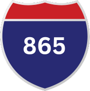 A blue and red highway sign with the number 865 on it