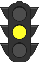 A traffic light with a yellow light on it.