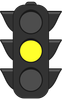 A traffic light with a yellow light on it.