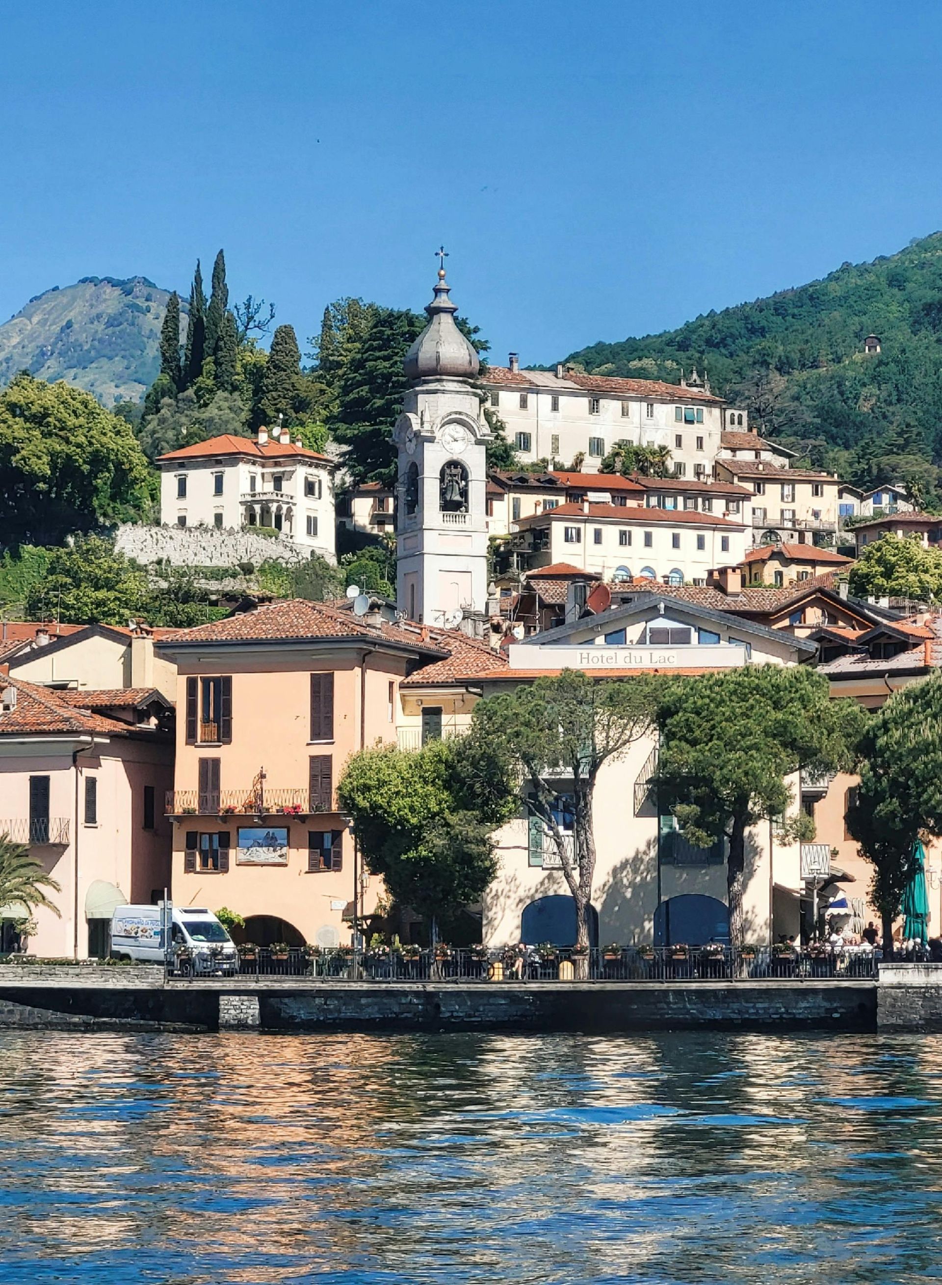 A small town with a clock tower in the middle of it