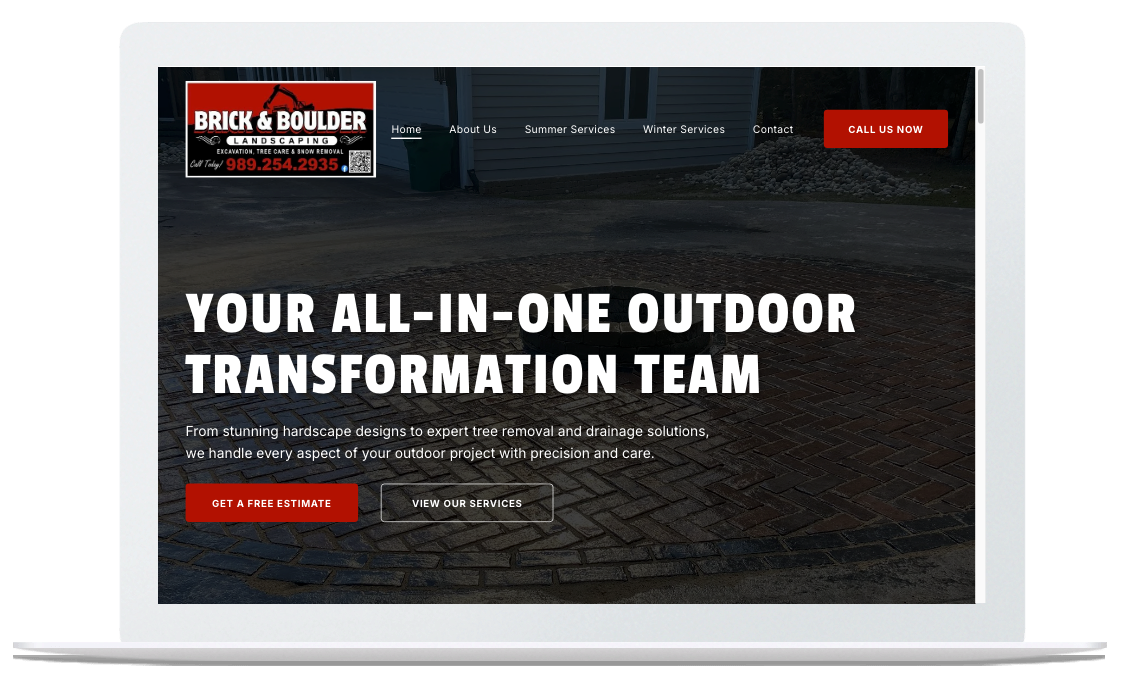 A laptop screen displaying the homepage for Brick & Boulder, an outdoor landscaping and transformation service.