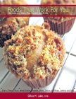picture of muffins sitting on cooling rack with white background and green title with red border Foods That Work For You Delectable and Gluten-Free Desserts and Drinks bottom of cookbook cover red bar with white font Olivia M. Lake, RHN 