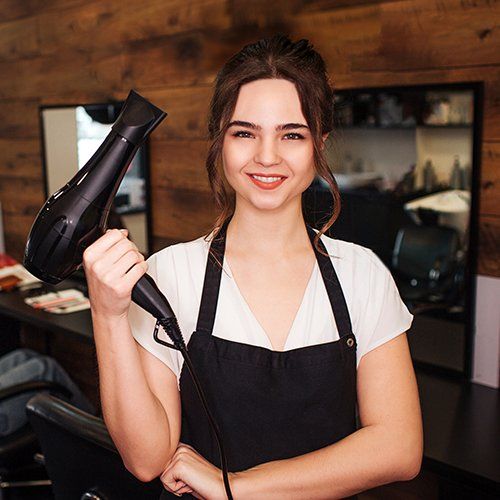 Smiling Hairdresser In Beauty Salon — Los Angeles, CA — Isis Hair Salon