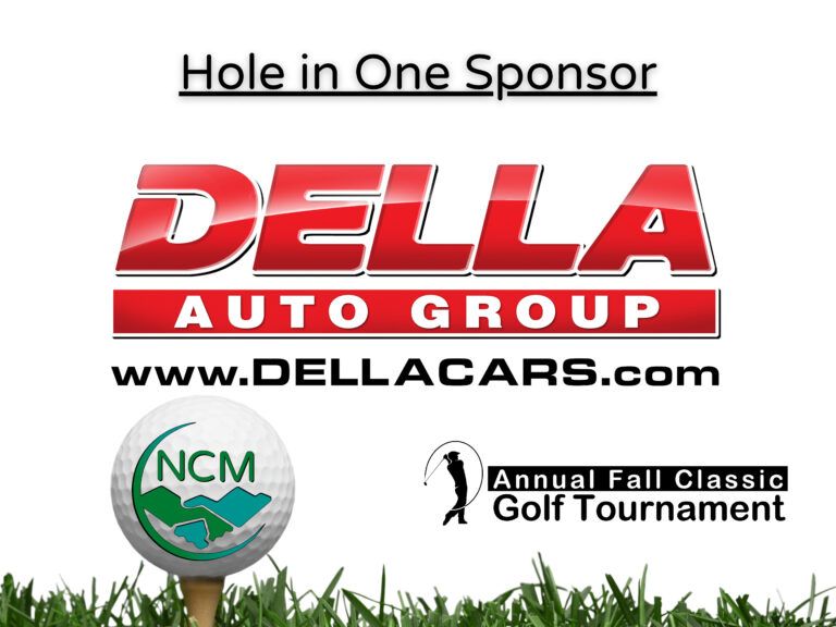 Della Auto Group logo on a sign for the NCM Annual Fall Classic Golf Tournament, indicating their Hole in One sponsorship.