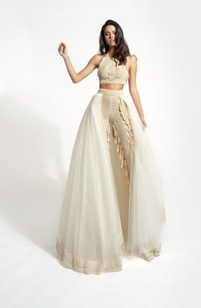 model on set in ivory wedding dress