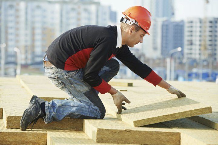 Man Picking Wood Tiles — Chattanooga, TN — Breeding Insulation Company