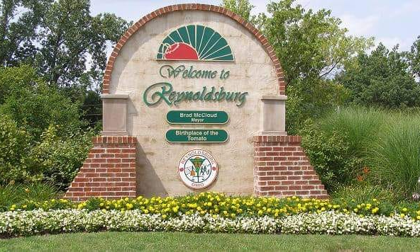 Welcome sign for Reynoldsburg with a brick and stucco design, green lettering, and a sunrise logo. Welcome sign for Reynoldsburg with a brick and stucco design, green lettering, and a sunrise logo.
