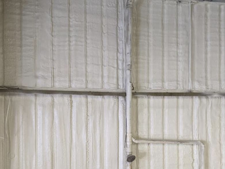 Closed Spray Foam Insulation with pipes.