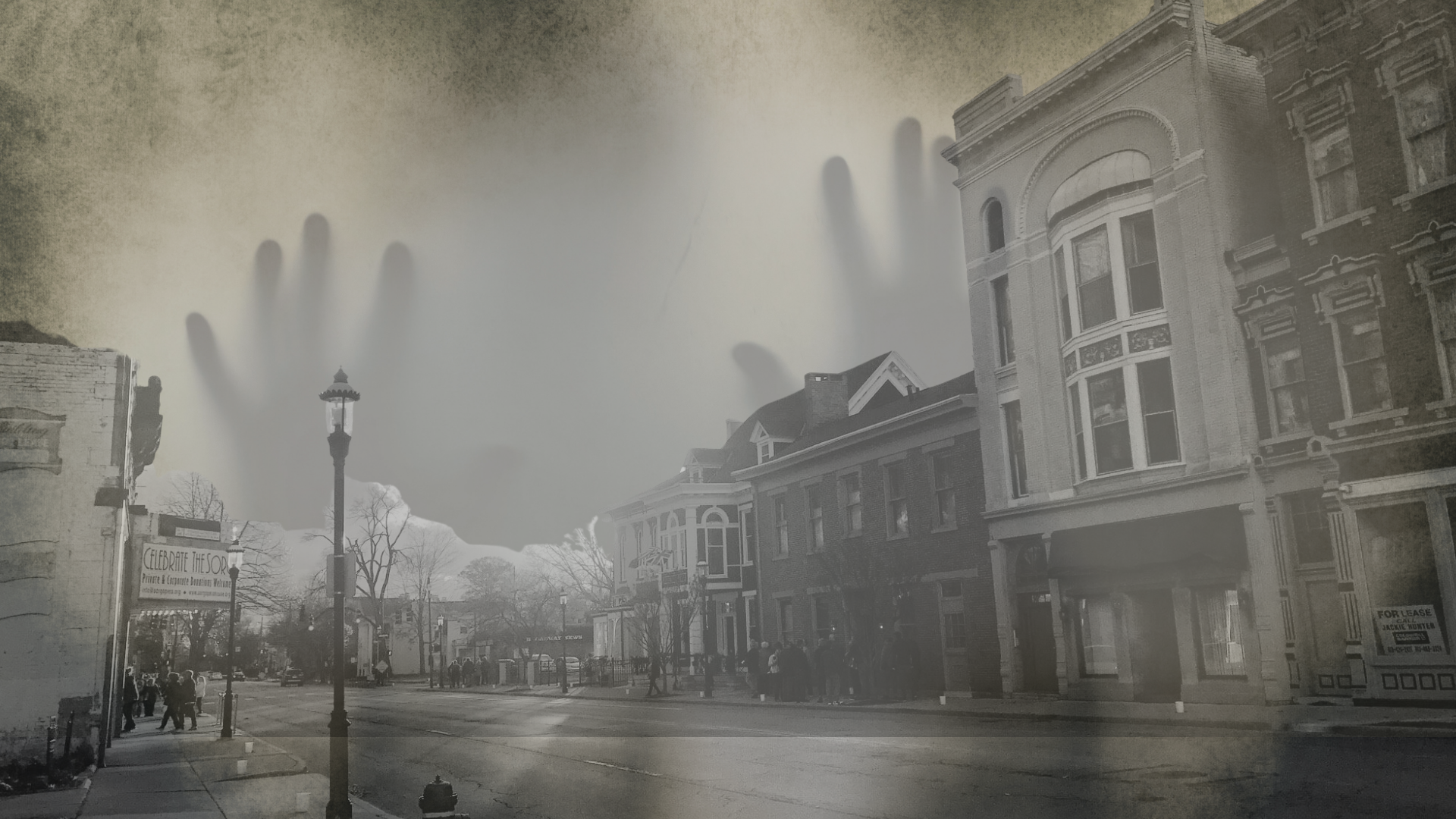 Giant, shadowy hands looming over a foggy, old-fashioned street with buildings and street lamps.