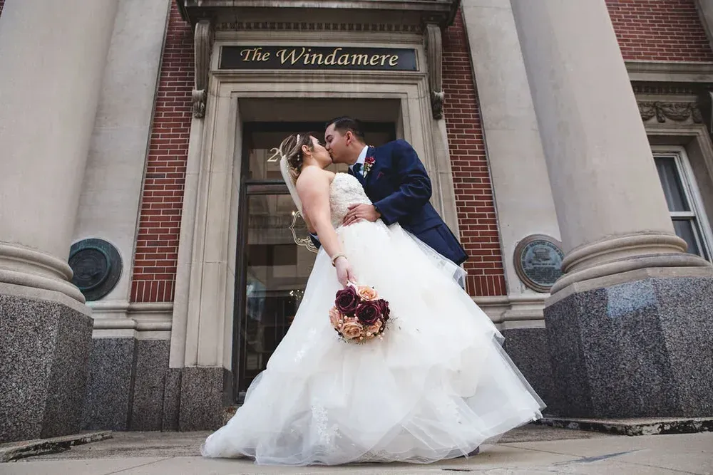 A couple kissing in front of 