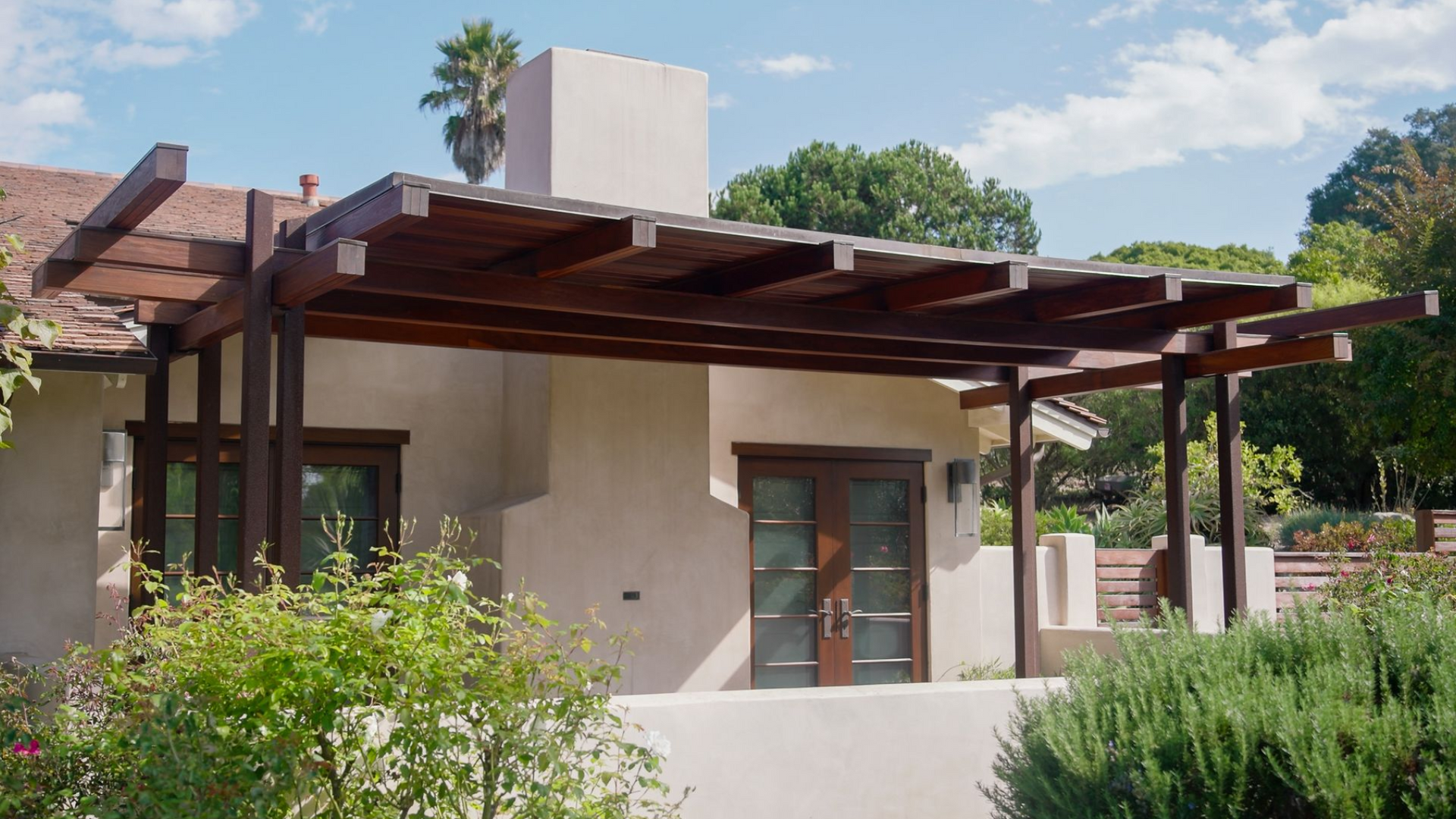 A large house with a lot of windows and a driveway