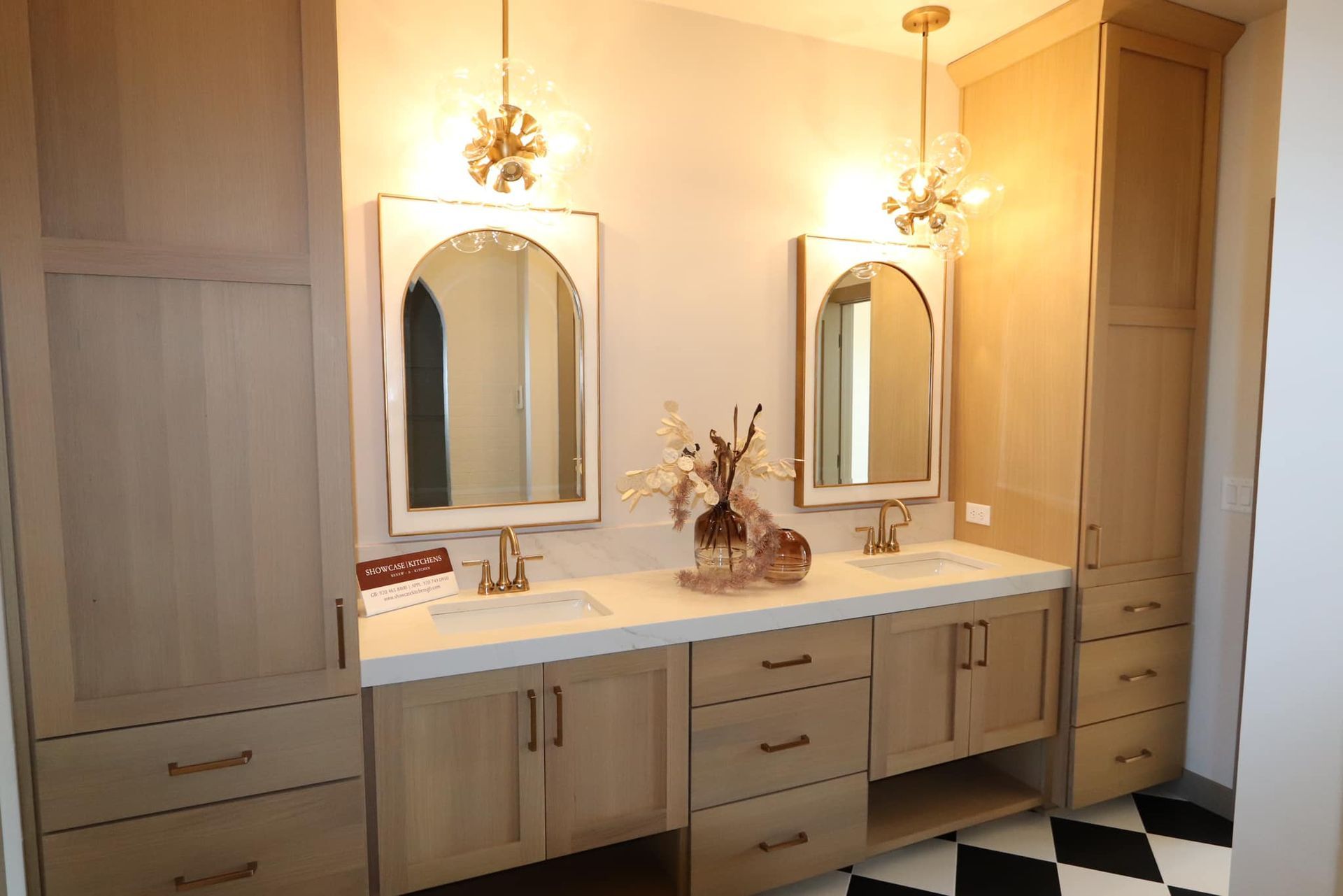 A bathroom with two sinks and two mirrors.