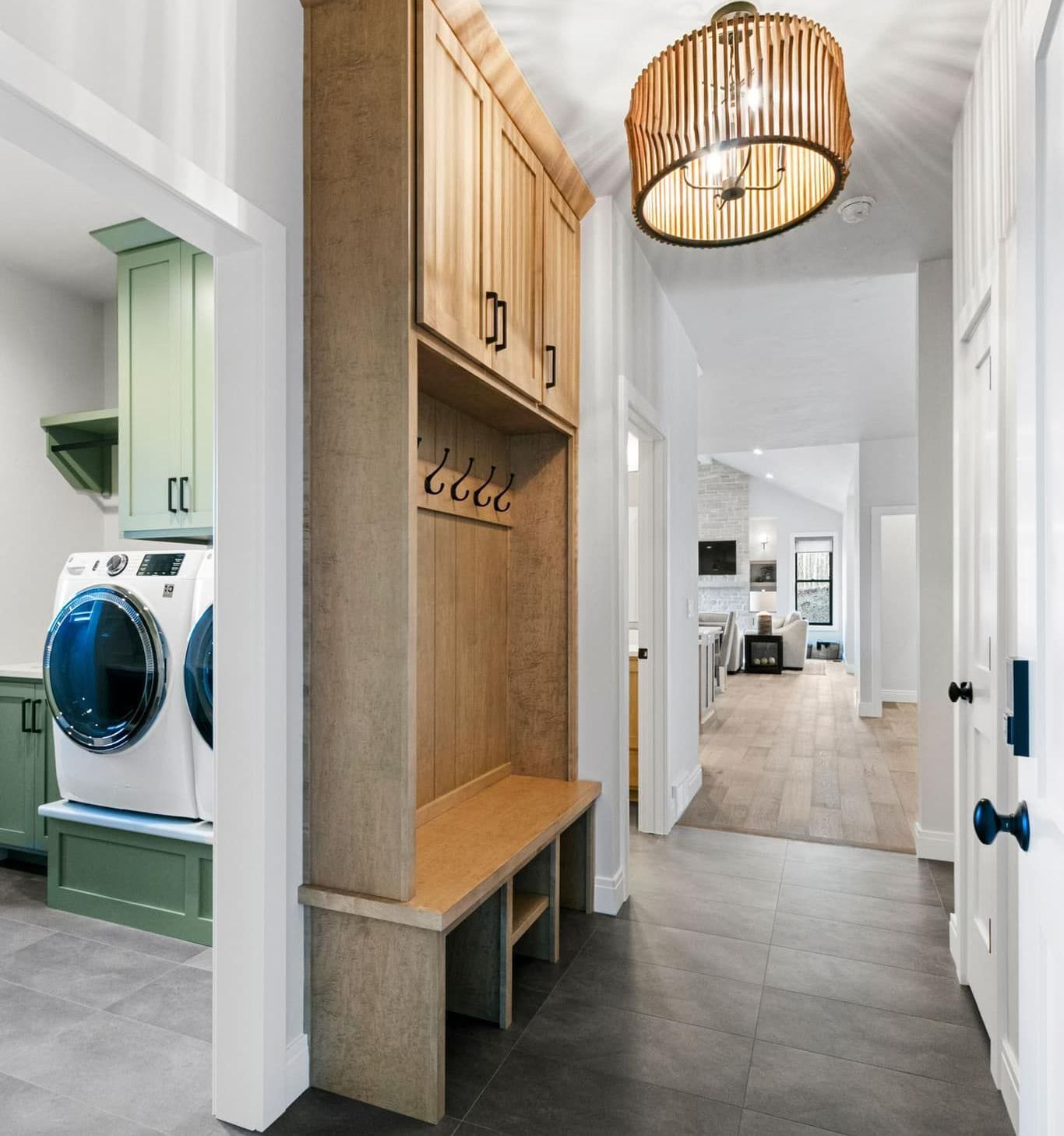 A hallway with a washer and dryer in it