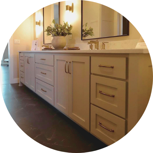 A bathroom with two sinks and two mirrors